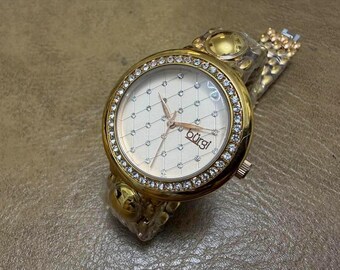 01 Reloj de mujer BURGI de cuarzo vintage, nuevo, de 36 mm, con bisel de cristal color oro rosa y esfera a cuadros.