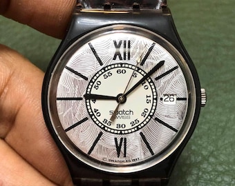 Reloj de cuarzo unisex Swatch Gent Tobacco de 34 mm de la colección 1993