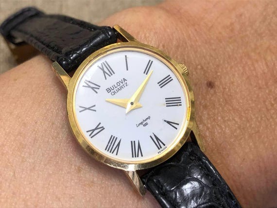 discontinued Bulova Longchamp white porcelain Dial Roman numerals quartz Ladies Watch 24mm