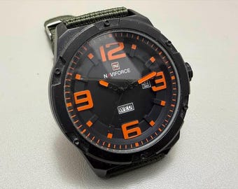 01 Unused NOS NAVIFORCE 48mm Quartz Military Watch with Unique Day-Date Layout & Orange Accents