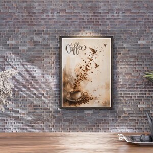 May include: Framed art print featuring a coffee-themed design. The artwork depicts coffee beans pouring into a cup, with birds flying above. The word "Coffee" is written in elegant script. The color palette includes shades of brown and beige.