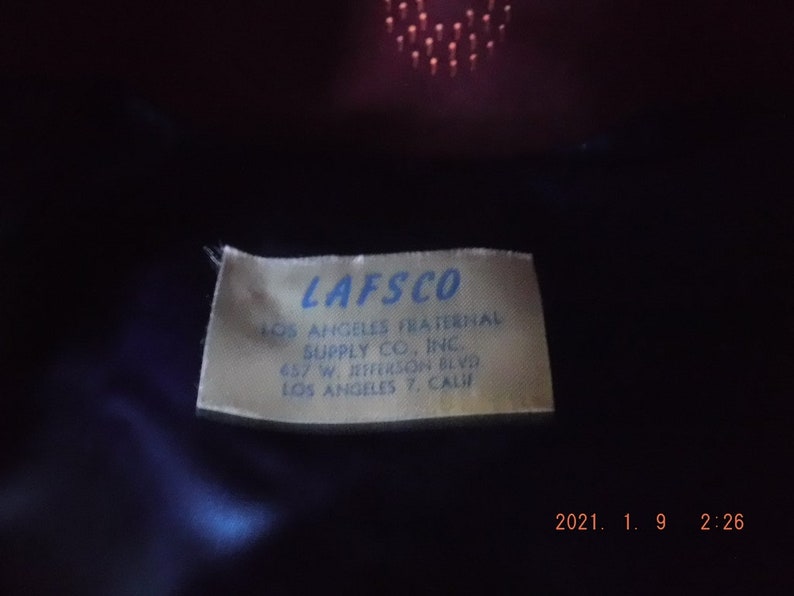 May include: A white label with blue text that reads "LAFSCO Los Angeles Fraternal Supply Co., Inc. 657 W. Jefferson Blvd. Los Angeles 7, Calif."