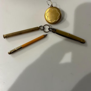 Pocket knife Foreign stamped on blade and pencil in case keychain and Ketchman and McDougall retractable