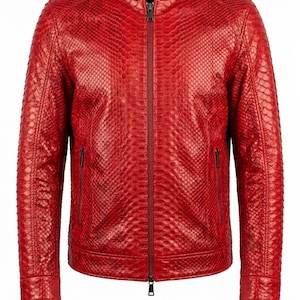 May include: A striking red leather jacket with a textured, snakeskin-effect pattern. It has a stand-up collar, a full-length zip, and two vertical zip pockets. The sleeves are long, and the design is sleek and modern, suitable for various occasions.