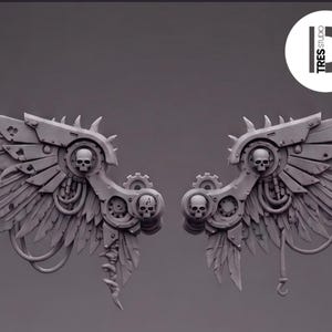 May include: A pair of grey mechanical wings featuring layered feathers, integrated gear mechanisms, and small skull motifs. The design includes metallic plates, curved tubing, and hanging decorative elements. A circular logo with the text TRES STUDIO is visible in the upper right corner.