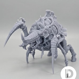 May include: A grey, unpainted resin miniature of a multi-legged creature with a segmented, armored carapace, sharp pointed limbs, and an exposed brain-like structure on its back. The figure features intricate organic textures and a TRES STUDIO logo.