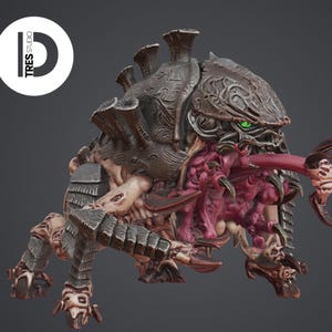 May include: A detailed miniature creature figurine featuring a dark brown, armored carapace with intricate swirling patterns, a fleshy pink underbelly, sharp claws, and glowing green eyes. The figure includes a logo reading TRES STUDIO.