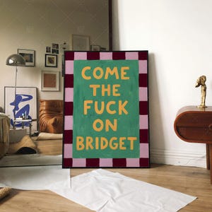 Come The Fuck On Bridget funny typography poster in frame on wall, retro wall art mockup displayed in contemporary living room with modern furniture and eclectic decor