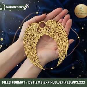 May include: A gold-colored, ornate wing-shaped embroidery design. The design is held in a person's hands. The image includes the text "EMBROIDERY FILES" and "Silk Threadss". The file formats are listed as DST, EMB, EXP, HUS, JEF, PES, VP3, and XXX.