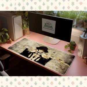 Könnte beinhalten: Ein Set aus drei Keramikbechern mit gesprenkelter, matter Oberfläche. Die Becher sind in den Farbtönen Creme, Hellgrau und Dunkelgrau gehalten. Jeder Becher hat ein schlichtes, minimalistisches Design und einen abgerundeten Griff.