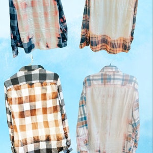 May include: Four plaid shirts with bleach-dyed designs. The shirts are hanging on hangers against a blue background. The shirts are all different colors and patterns.