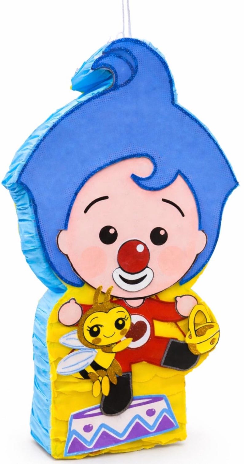 May include: A colorful pinata in the shape of a cartoon character with blue hair, a red nose, and a red outfit. A yellow bee with glitter accents is featured on the front. The pinata has a yellow and blue base.