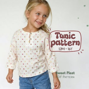 Puede incluir: Una niña con una túnica color crema con un estampado de lunares rosas, amarillos y marrones. La túnica tiene mangas largas y un cuello abotonado. La imagen incluye el texto "Tunic pattern 12M-16Y".