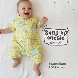 May include: A smiling baby wearing a yellow snap-up onesie with a whimsical pattern of cartoon creatures and rainbows. The onesie has short sleeves and a front pocket. Text on the image reads "Snap-up onesie 0M-2T" and "Sweet Pleat PDF Pattern".