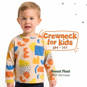 May include: A beige long-sleeved crewneck shirt for kids, featuring a colorful abstract pattern in orange, blue, and yellow. The shirt has a blue pocket and the text "Crewneck for kids 3M-14Y" and "Sweet Pleat PDF Pattern".