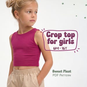 May include: A young girl wearing a magenta crop top and tan shorts. The crop top is sleeveless and has a round neckline. Text on the image reads "Crop top for girls 6M-16Y" and "Sweet Pleat PDF Pattern".
