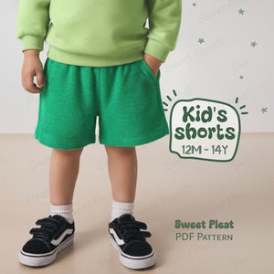 May include: A child wearing a light green sweatshirt and green shorts. The shorts have pockets and are paired with black sneakers with white soles. The image includes text that reads "Kid's shorts 12M-14Y" and "Sweet Pleat PDF Pattern."