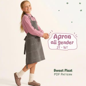 May include: A young person wearing a gray apron over a pink shirt, paired with brown shoes and white socks. The apron is labeled "Apron all gender 2T-16Y". The image also includes the text "Sweet Pleat PDF Pattern".