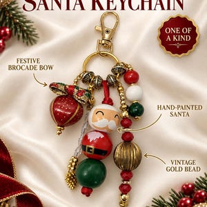 May include: A handmade Santa keychain featuring a hand-painted Santa bead, a festive brocade bow, a vintage gold bead, and various red, white, and green beads. The keychain includes a gold-tone lobster clasp and ring, with text reading HANDMADE SANTA KEYCHAIN, ONE OF A KIND, FESTIVE BROCADE BOW, HAND-PAINTED SANTA, and VINTAGE GOLD BEAD.