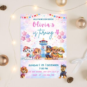 May include: A colourful Paw Patrol birthday invitation. The design includes the text "ALL PAWS ON DECK! Olivia's is turning 4", cartoon characters, star balloons, and a lighthouse. The date and time of the party are also displayed.