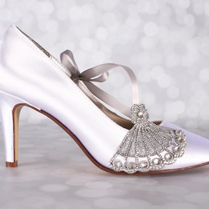 Gatsy style custom wedding shoes with a silver crystal art deco embellishment on the toe closed toe mid heel bridal shoes perfect for a roaring 20s wedding