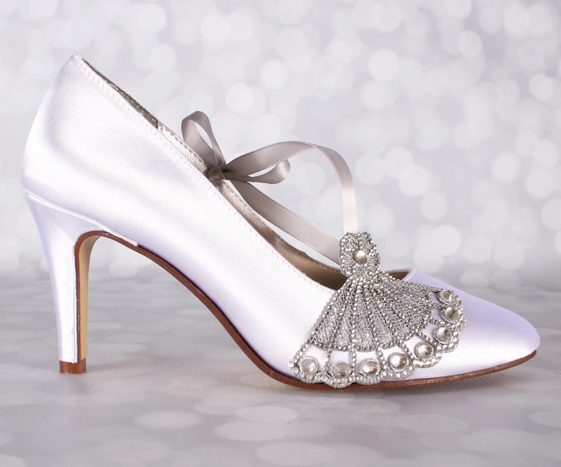 Gatsy style custom wedding shoes with a silver crystal art deco embellishment on the toe closed toe mid heel bridal shoes perfect for a roaring 20s wedding
