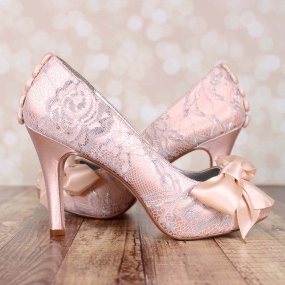Romantic blush pink bridal heels with flower embellishments