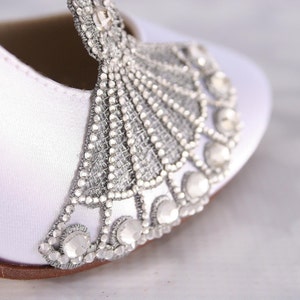 Gatsy style custom wedding shoes with a silver crystal art deco embellishment on the toe closed toe mid heel bridal shoes perfect for a roaring 20s wedding