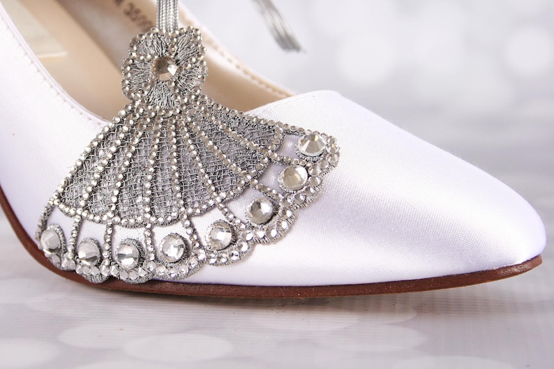 Gatsy style custom wedding shoes with a silver crystal art deco embellishment on the toe closed toe mid heel bridal shoes perfect for a roaring 20s wedding