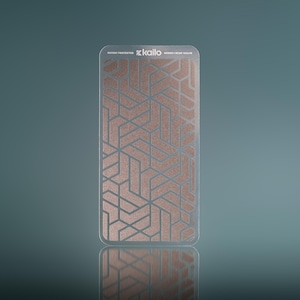 May include: A rectangular phone accessory with a geometric pattern in copper and silver tones. The text "kailo" and "SERIES 1 NCAP-163-TB" are visible. The accessory is patent protected and reflects on a glossy surface.