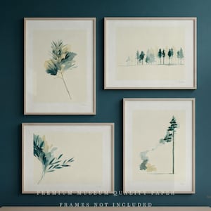 May include: Four framed watercolor art prints featuring botanical and forest themes. The prints showcase delicate green and blue foliage and trees against a cream background. The frames are a light wood color. The text at the bottom reads "PREMIUM MUSEUM QUALITY PAPER" and "FRAMES NOT INCLUDED."