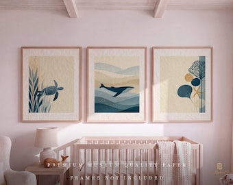 May include: A set of three wall art prints featuring ocean themes. The left print shows a sea turtle among seaweed. The center print depicts a whale swimming in layered waves. The right print displays coral, a starfish, and circular shapes.