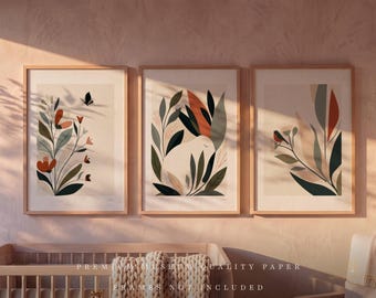 May include: Three framed wall art prints featuring botanical illustrations with a butterfly, a rabbit, and a bird. The artwork uses a muted color palette of terracotta, sage green, and cream. The text reads PREMIUM MUSEUM QUALITY PAPER FRAMES NOT INCLUDED.