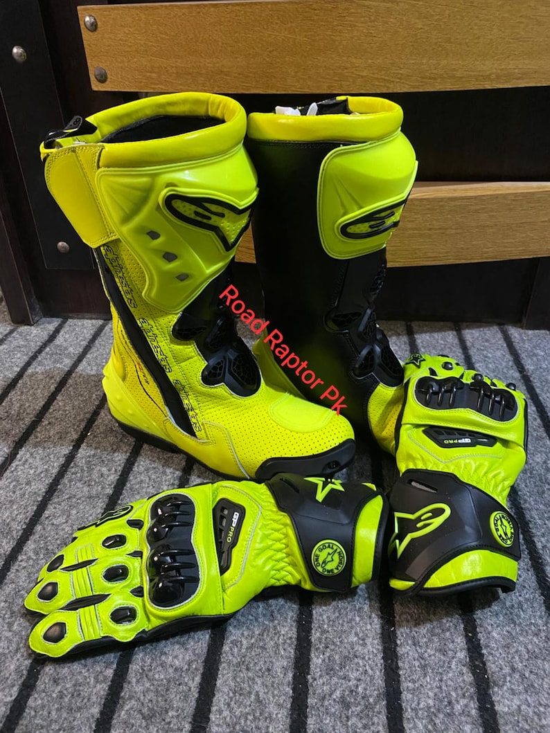 May include: A pair of neon yellow and black motorcycle boots and matching gloves. The boots are high-top with protective features, and the gloves have reinforced knuckles. The text "Road Raptor Pk" is visible on the image.