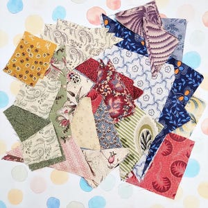 May include: A collection of fabric scraps in various shapes and sizes, featuring floral, paisley, and geometric patterns. The color palette includes shades of red, blue, green, yellow, and cream. The fabrics are arranged on a white background with watercolor polka dots.