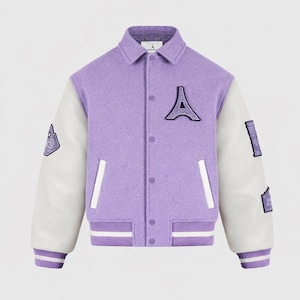 May include: A lavender and white varsity jacket with a button-up front, white sleeves, and a lavender collar. The jacket features a large letter "A" patch and other patches on the sleeves. The cuffs and hem have white stripes.