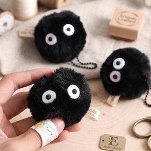Handmade fuzzy Soot Sprite keychain bundle with 8 plush charms for Studio Ghibli fans and anime accessories.