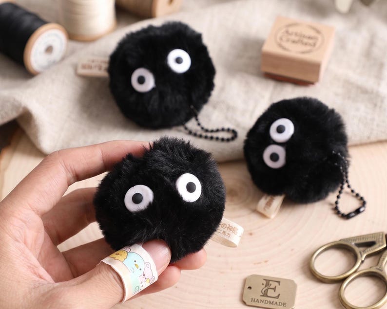 Handmade fuzzy Soot Sprite keychain bundle with 8 plush charms for Studio Ghibli fans and anime accessories.