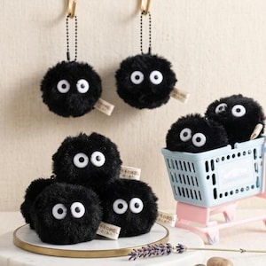 SOFA brand home decor soot sprite bundle featuring 6 plus 2 free extra plush charms in a bright, professional studio setting.