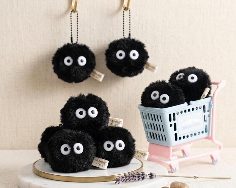 SOFA brand home decor soot sprite bundle featuring 6 plus 2 free extra plush charms in a bright, professional studio setting.