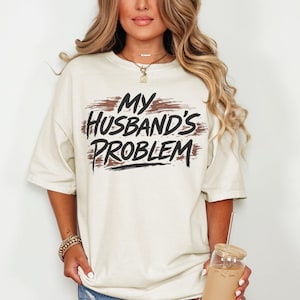 May include: A rustic wooden sign with the text "Welcome" in a handwritten style. The sign is painted white with a distressed finish, and a small, decorative heart is attached to the bottom. The background is a blurred image of a wooden surface.