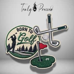 May include: Three embroidered patches featuring golf themes. One circular patch displays a golfer, pine trees, and the text "BORN TO Golf". Another patch shows two crossed golf clubs and a ball. The third patch depicts a green with a red flag.