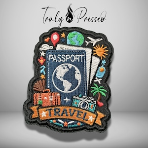 May include: An embroidered patch featuring a blue passport with a globe icon, a brown suitcase, a teal camera, and a palm tree. The design includes a banner with the word TRAVEL, surrounded by icons of a plane, sun, and map pin on a black border.