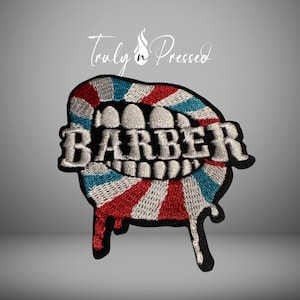 May include: Embroidered patch featuring a stylized mouth with the word "BARBER" in white. The mouth design has red, white, and blue stripes, with a dripping effect at the bottom. The text "Truly n Pressed" is at the top.