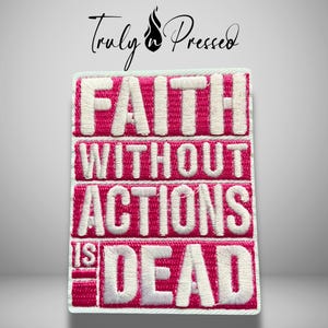 May include: A rectangular embroidered patch featuring the white text FAITH WITHOUT ACTIONS IS DEAD set against a vibrant hot pink background. The lettering is bold and blocky, with a white border surrounding the entire rectangular design.