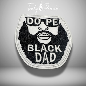 May include: A white and black embroidered patch featuring a stylized graphic of a person with a thick beard and sunglasses. The text DO PE is positioned above the beard, and the text BLACK DAD is embroidered in white within the black beard area.
