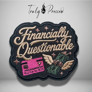 May include: A black embroidered patch featuring the text "Financially Questionable" in beige script. Below the text is a pink credit card and a green dollar bill with beige wings. Small beige star accents are scattered around the design.