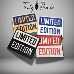 May include: Four embroidered patches with the words "LIMITED EDITION" in white, on a black, red, blue, and yellow background. The patches are rectangular with rounded corners. The text "Truly Pressed" is at the top.
