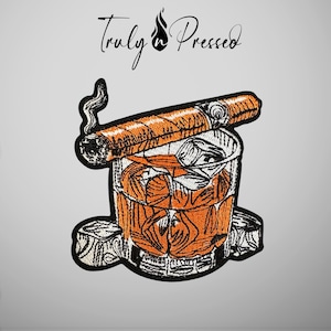 May include: An embroidered patch featuring a glass of amber liquid with ice cubes and a lit cigar resting on top. The design includes black outlines and orange fill colors. Above the illustration, the text Truly Pressed is written in black.