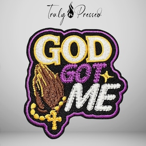 May include: An embroidered patch featuring the text GOD GOT ME in white and purple thread against a black background. The design includes brown praying hands with a yellow rosary and cross, surrounded by a purple border and a small yellow star.